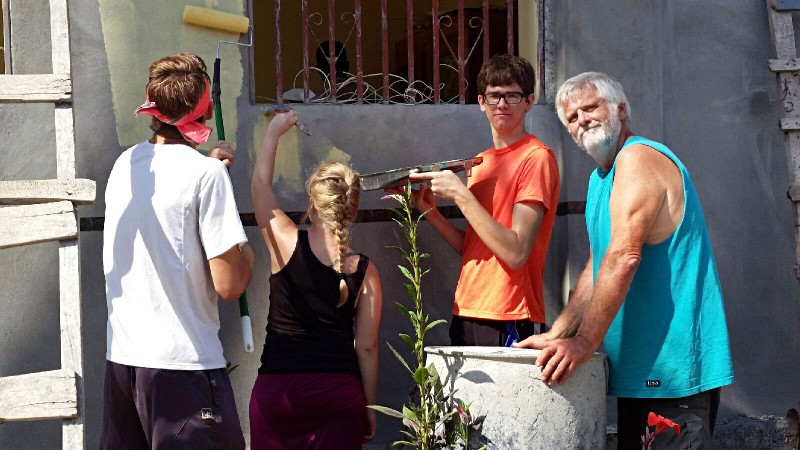 Painting exterior school office.