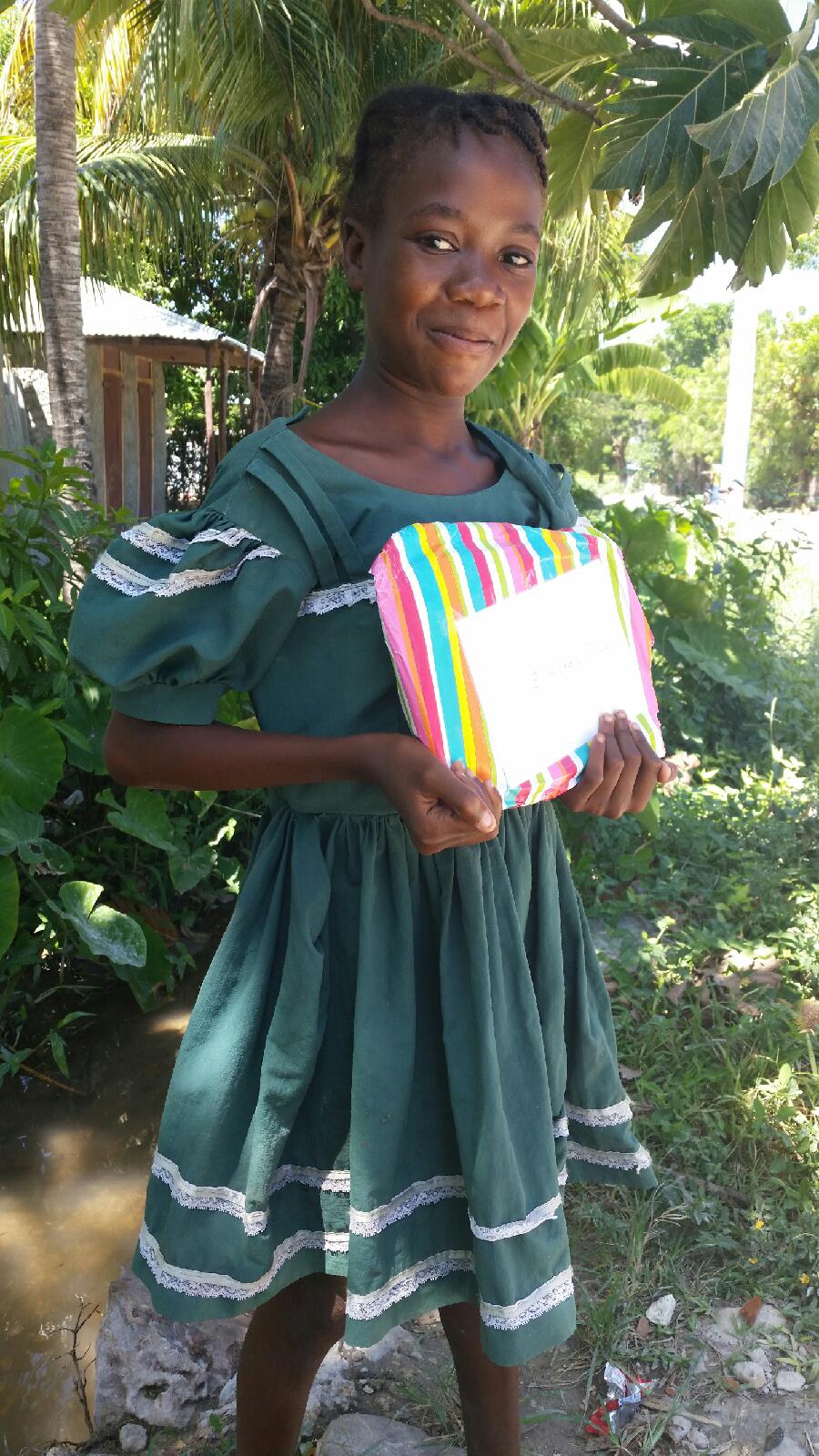 Elmires is delighted with her gift from her sponsor